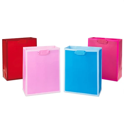 9" Medium Solid Color Gift Bags - Pack of 4 in Red, Blue, Light Pink a