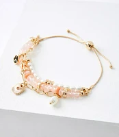 Pearlized Charm Pull Tie Bracelet