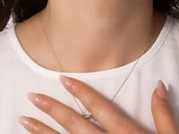 Diamond Infinity Necklace in 10K Yellow Gold (0.08 ct tw)