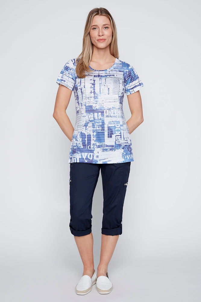 Le t-shirt imprimé journal dévoré