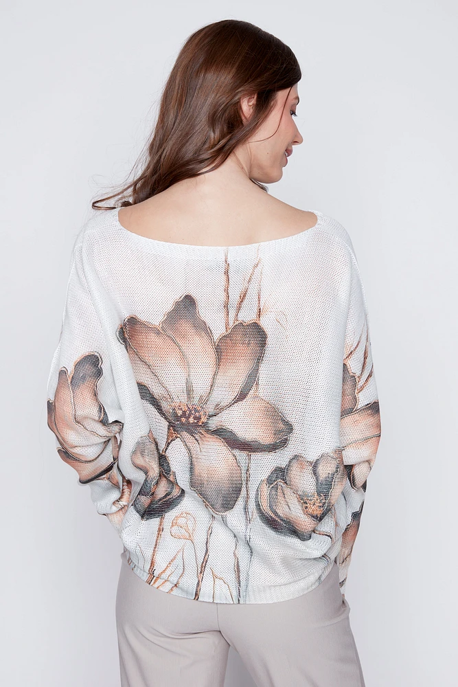 Le pull en maille imprimé fleuri