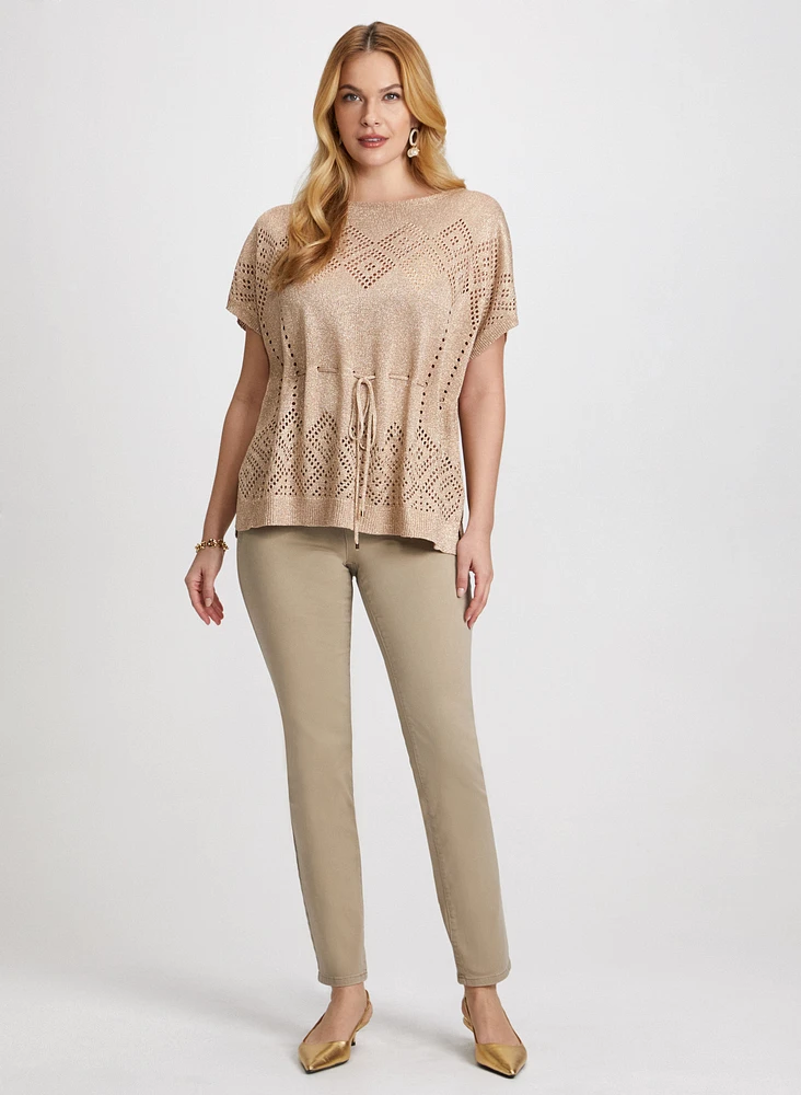 Pull en tricot et jean à broderies
