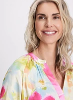 Blouse florale sans col