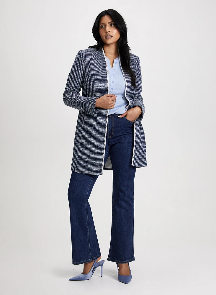 Veste longue en bouclé à bordure contrastante