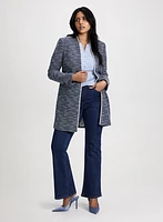 Veste longue en bouclé à bordure contrastante