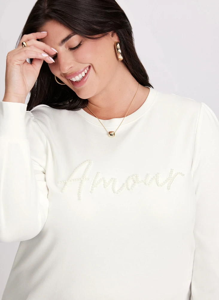 Pull à manches longues et broderie perlée