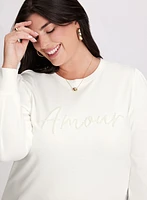 Pull à manches longues et broderie perlée