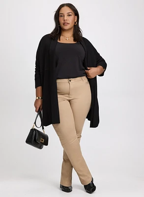 Cardigan ouvert et jean à jambe étroite