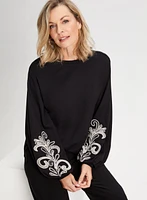 Haut à manches bouffantes et broderies