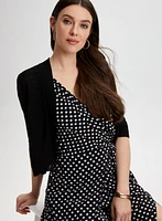 Boléro en tricot pointelle