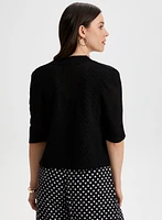 Boléro en tricot pointelle