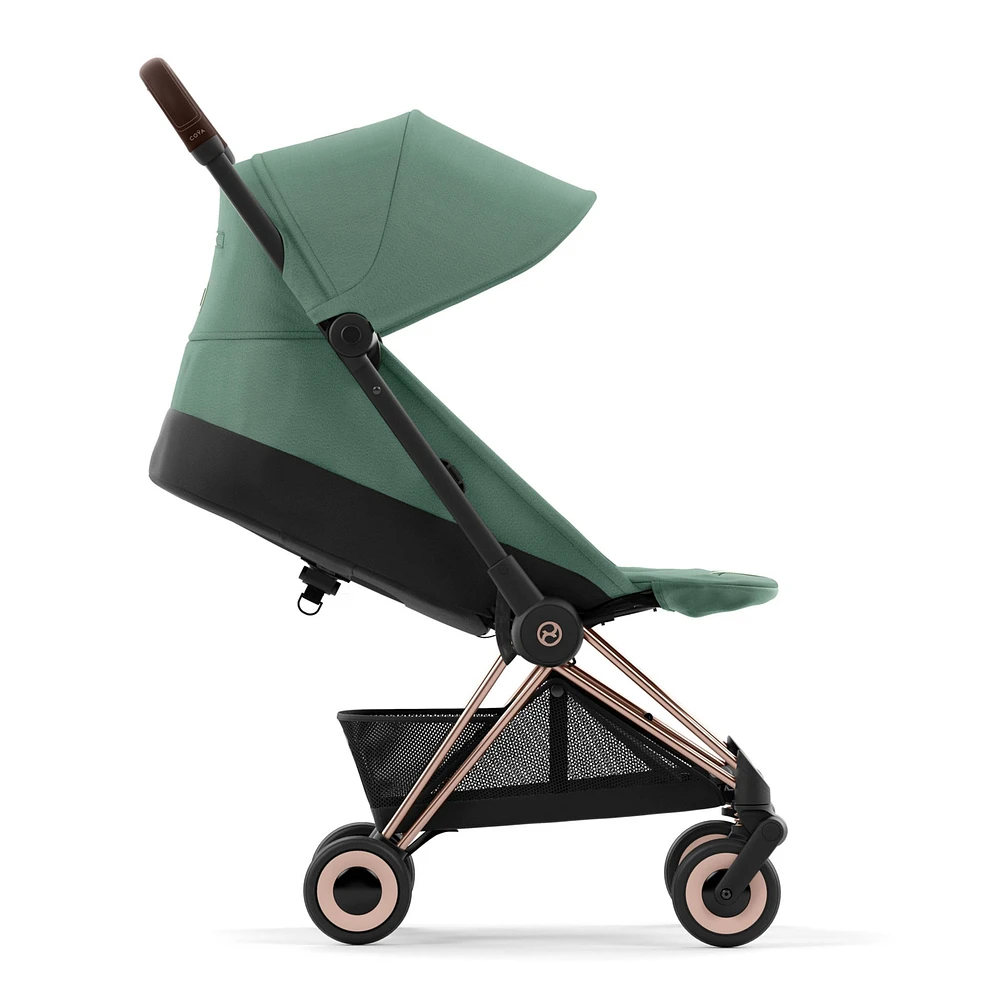 Poussette Coya - Cadre or rose avec siège vert feuillage