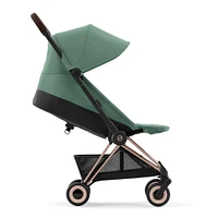 Poussette Coya - Cadre or rose avec siège vert feuillage