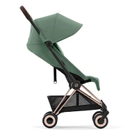 Poussette Coya - Cadre or rose avec siège vert feuillage