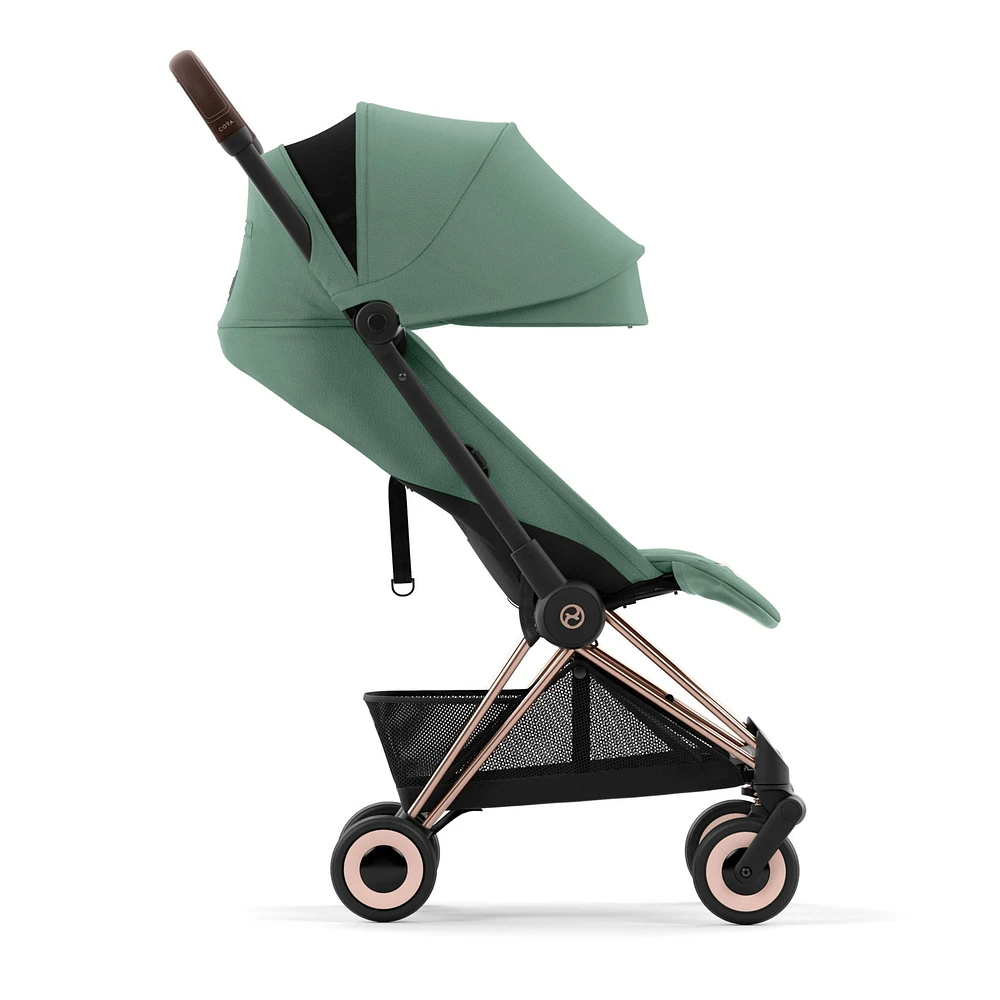 Poussette Coya - Cadre or rose avec siège vert feuillage