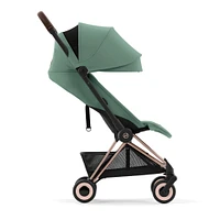 Poussette Coya - Cadre or rose avec siège vert feuillage