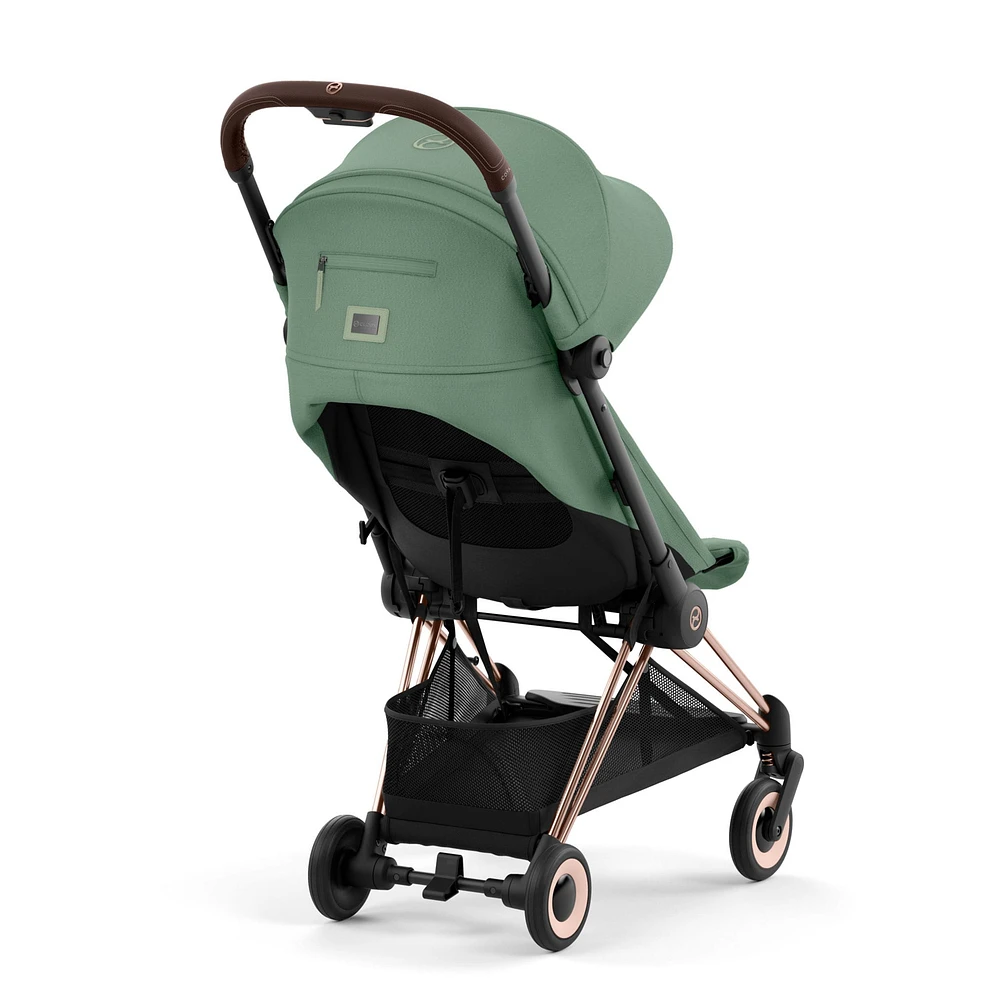 Poussette Coya - Cadre or rose avec siège vert feuillage