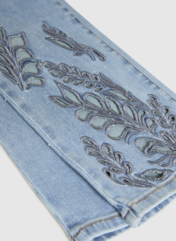 Jean à jambe droite broderies