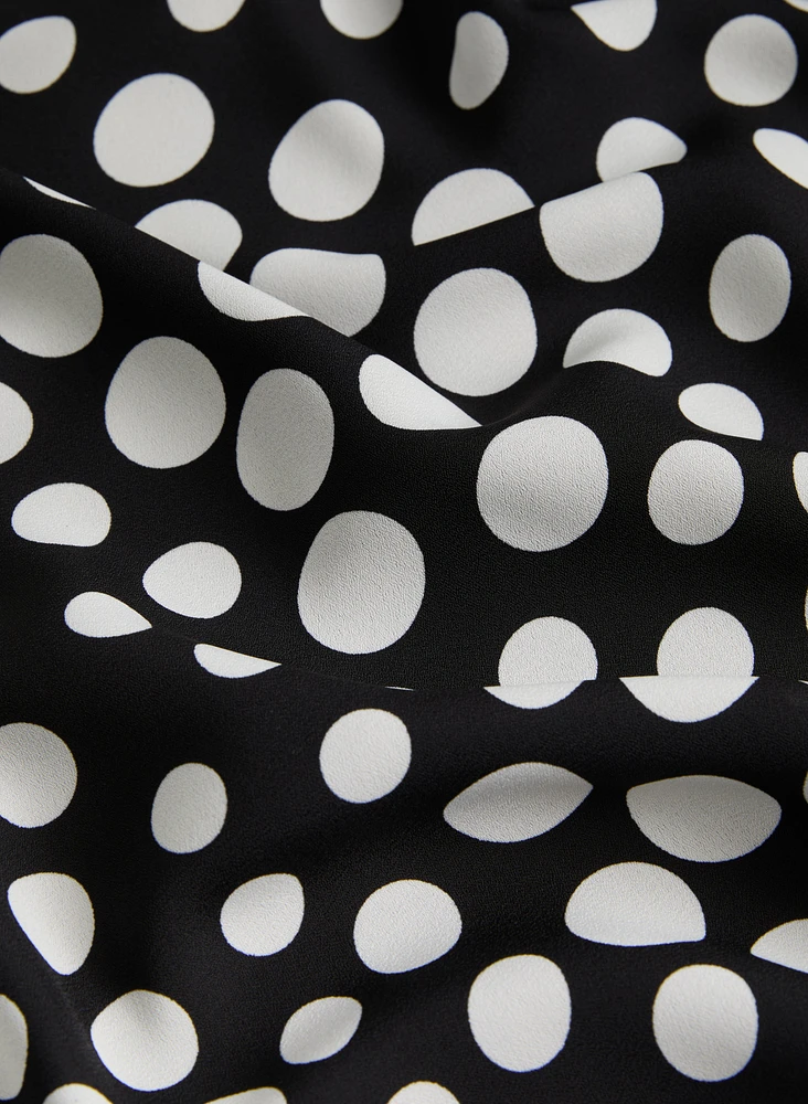 Blouse sans manches à pois