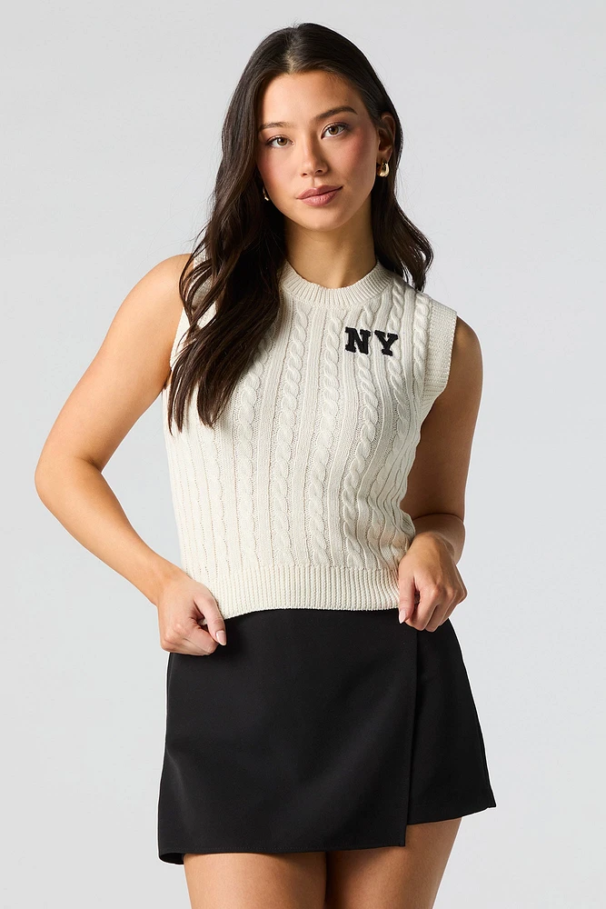 Veste en tricot torsadé avec motif brodé