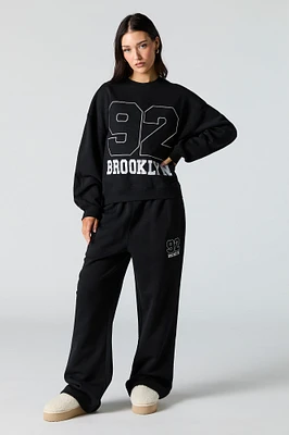 Pantalon d'entraînement à jambe large en molleton avec motif