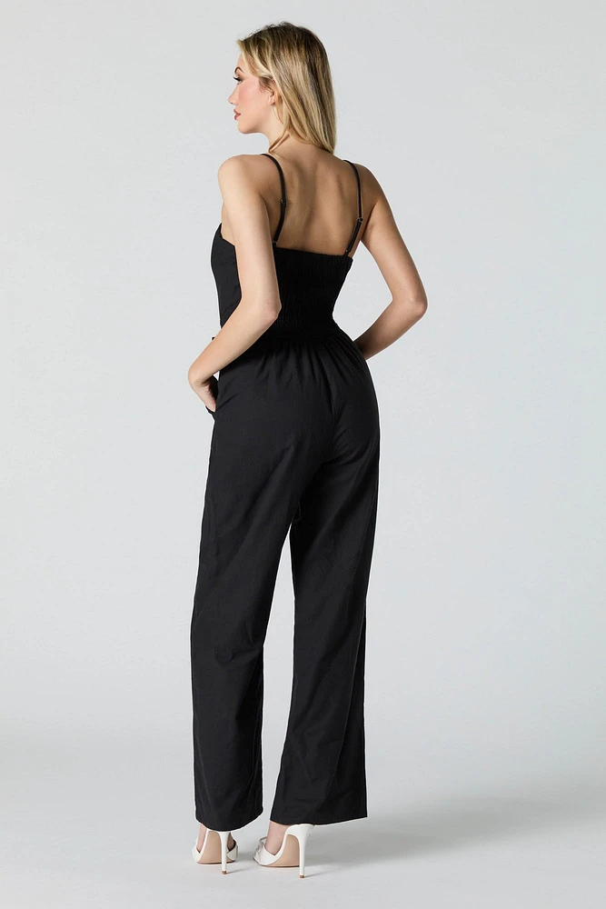 Combinaison jambe large avec ceinture et devant boutonné