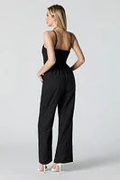 Combinaison jambe large avec ceinture et devant boutonné