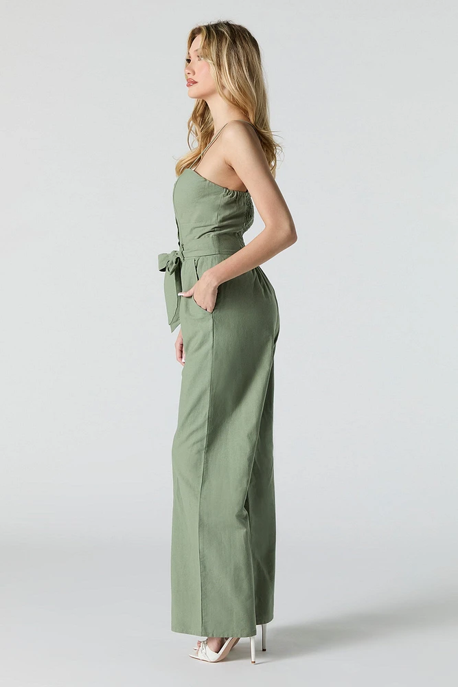 Combinaison jambe large avec ceinture et devant boutonné