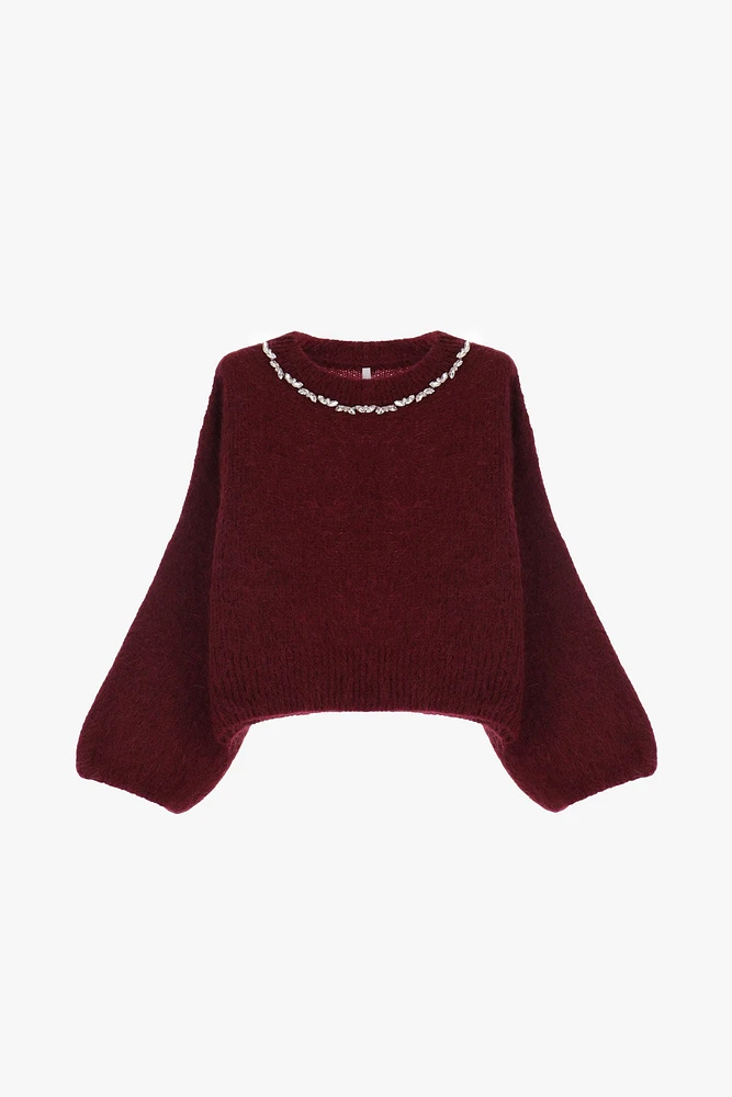 Pull ras du cou orné de bijoux
