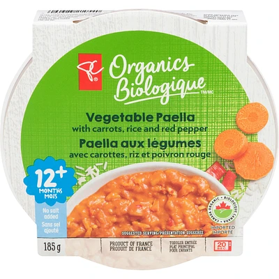 Plat Paella aux légumes avec carottes, riz et poivrons rouges