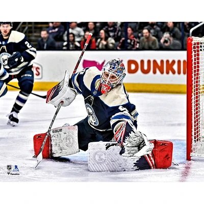 Elvis Merzlikins Columbus Blue Jackets Unsigned Alternate Jersey Glove Save Photograph