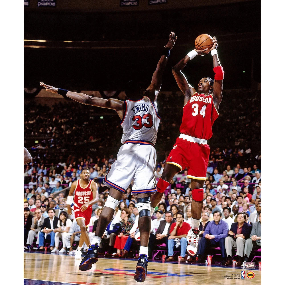 Hakeem Olajuwon Houston Rockets Unsigned Red Jersey Shooting Photograph