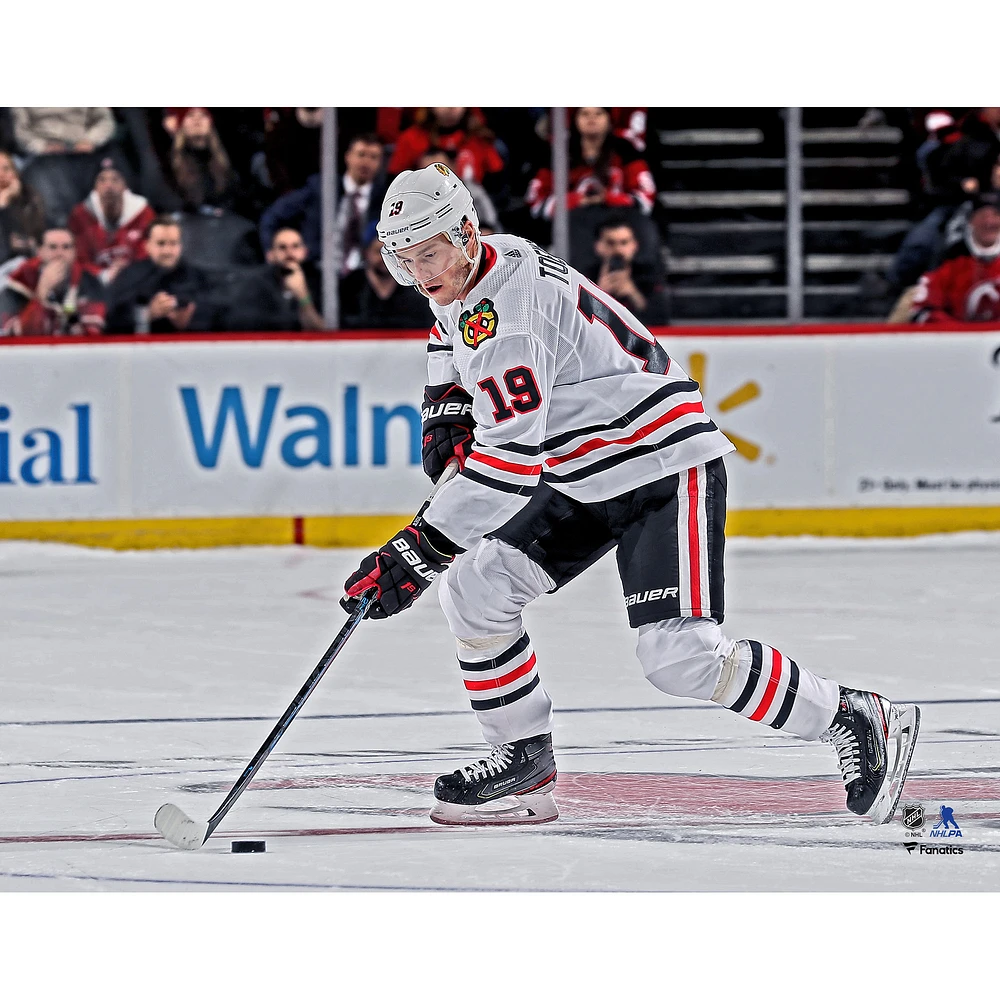Jonathan Toews Chicago Blackhawks Unsigned White Jersey Skating Photograph