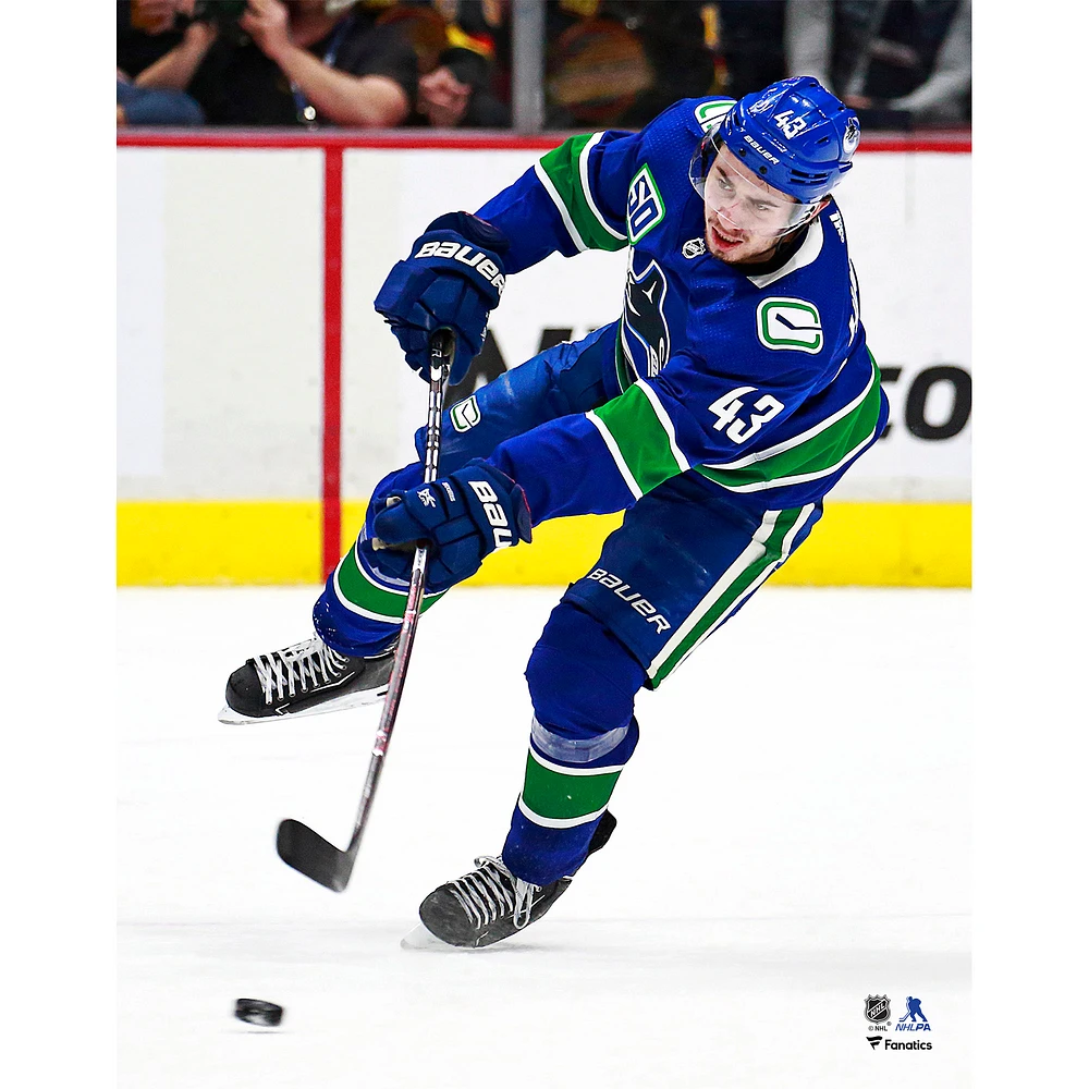 Quinn Hughes Vancouver Canucks Unsigned Blue Jersey Passing Photograph