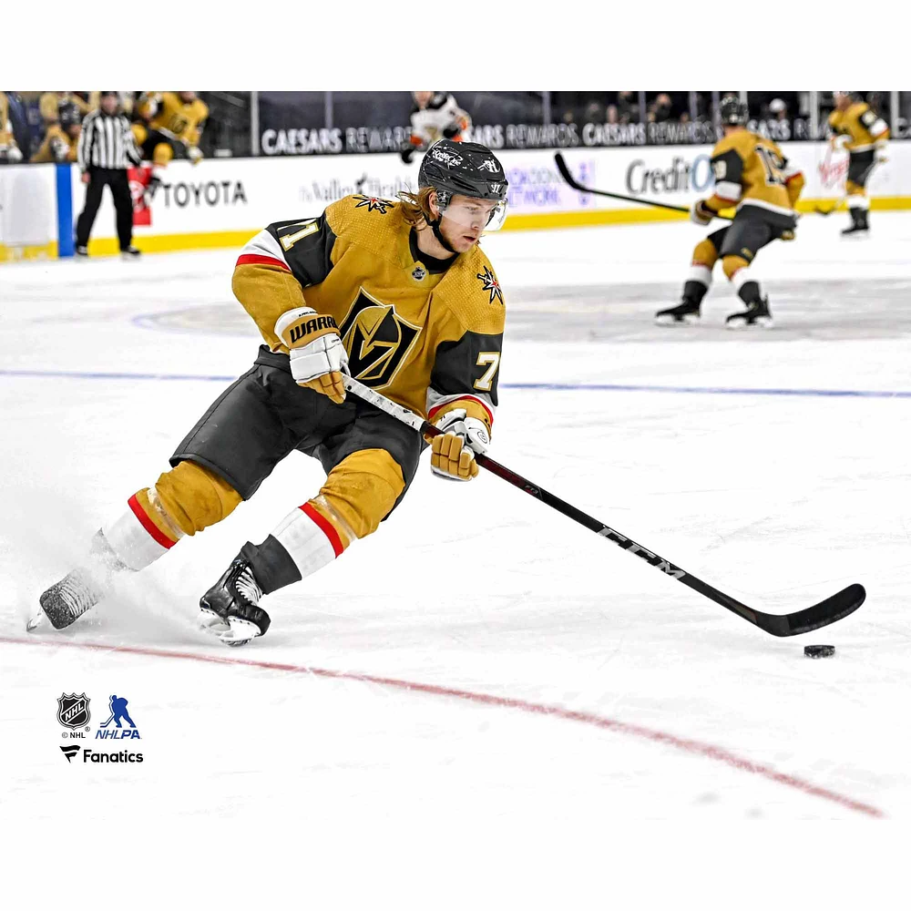 William Karlsson Vegas Golden Knights Unsigned Gold Alternate Jersey Skating with Puck vs. Anaheim Ducks Photograph