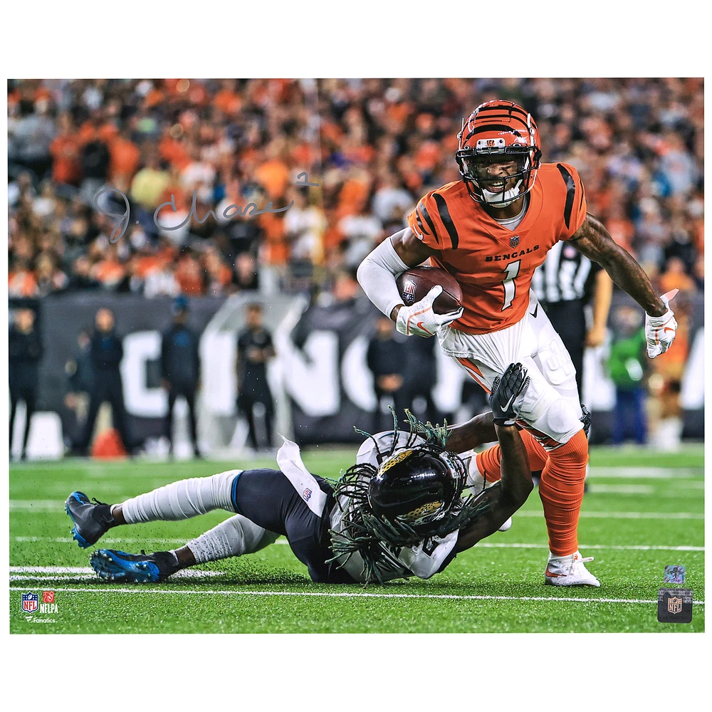 Ja'Marr Chase Cincinnati Bengals Autographed 16'' x 20'' Orange Breaking Tackle Photograph
