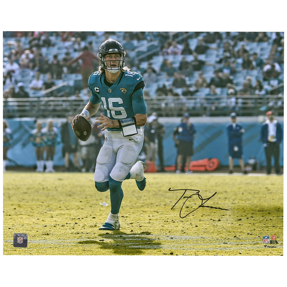 Trevor Lawrence Jacksonville Jaguars Autographed 16'' x 20'' Horizontal Teal Jersey Rollout Photograph
