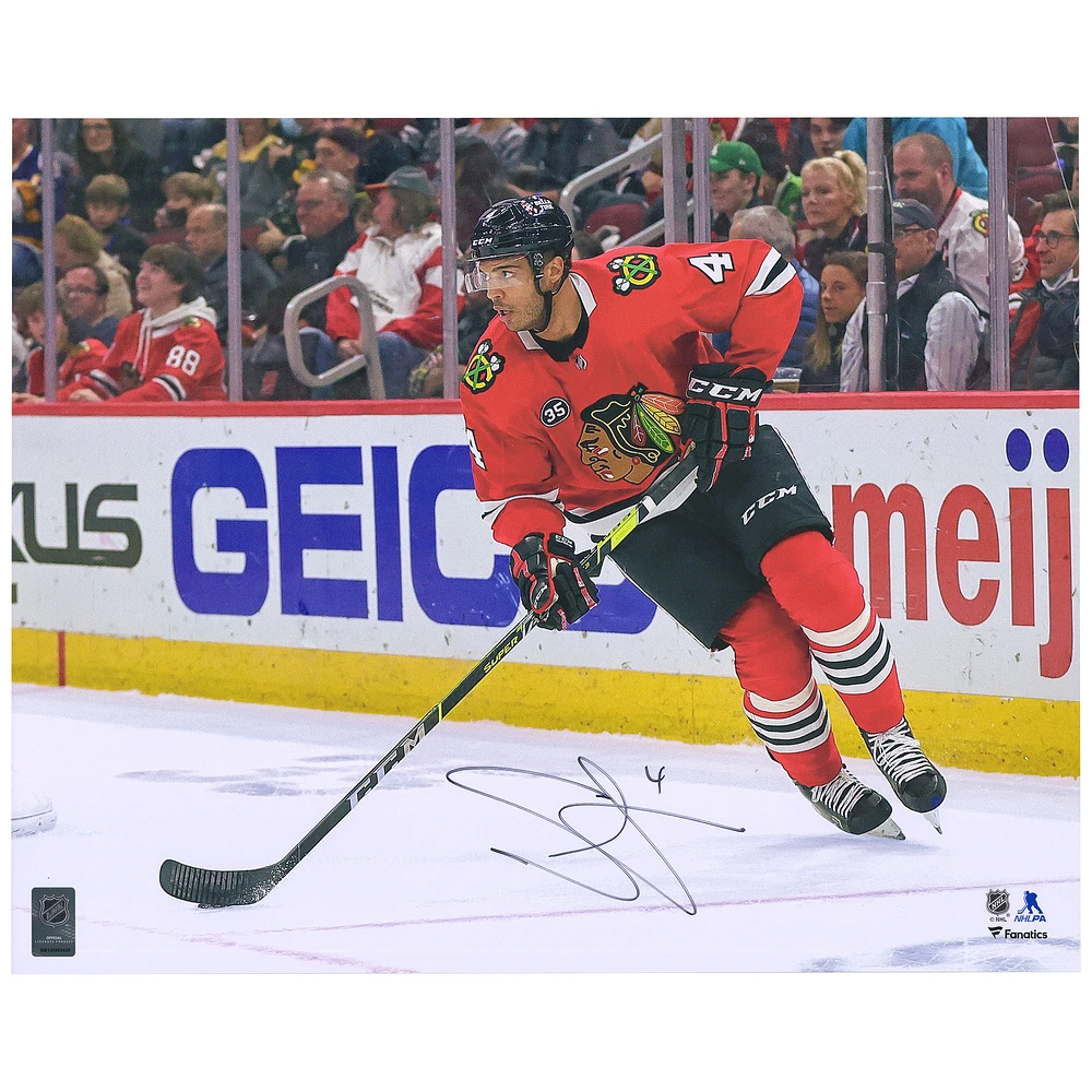 Seth Jones Chicago Blackhawks Autographed 16" x 20" Red Jersey Skating Photograph