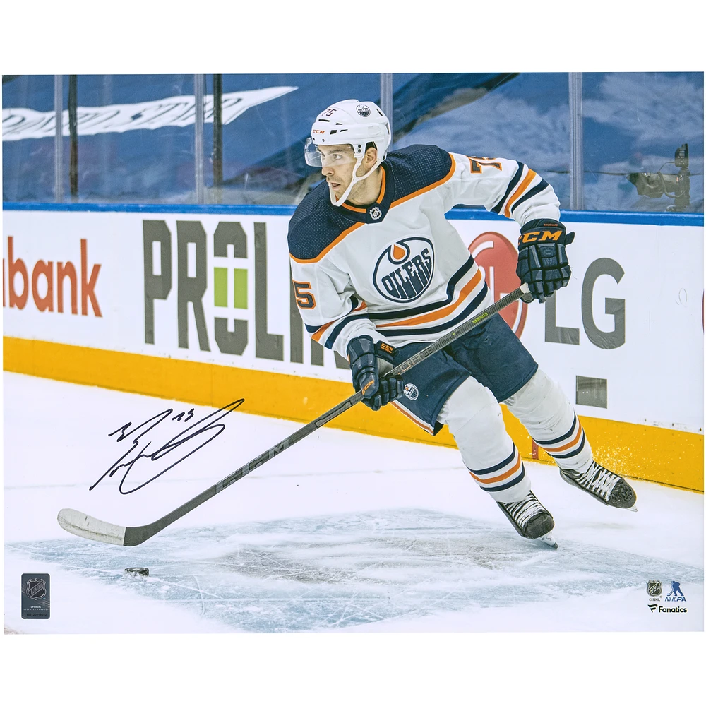 Evan Bouchard Edmonton Oilers Autographed 16'' x 20'' White Jersey with Puck Photograph