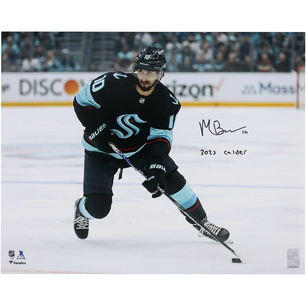 Matty Beniers Autographed Seattle Kraken 2023 Calder Trophy Winner 16" x 20" Navy Jersey with Puck Photograph with "2023 Calder" Inscription