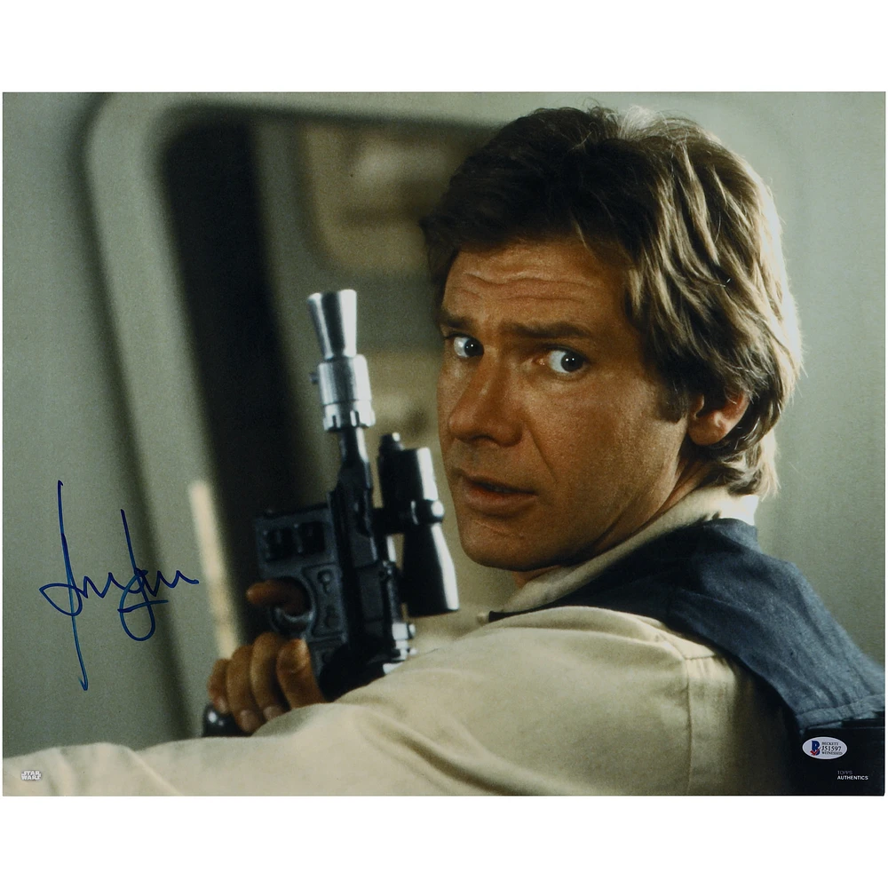 Harrison Ford The Empire Strikes Back Autographed 16" x 20" Holding a Gun Photograph - BAS