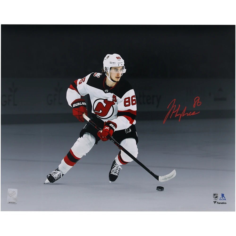 Jack Hughes New Jersey Devils Autographed 16" x 20" White Jersey Skating Spotlight Photograph