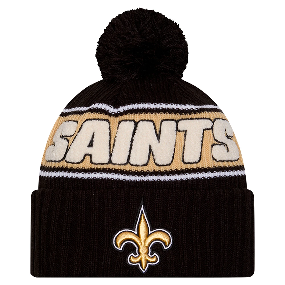 Men's New Era Black New Orleans Saints 2024 Sideline Cuffed Knit Hat with Pom