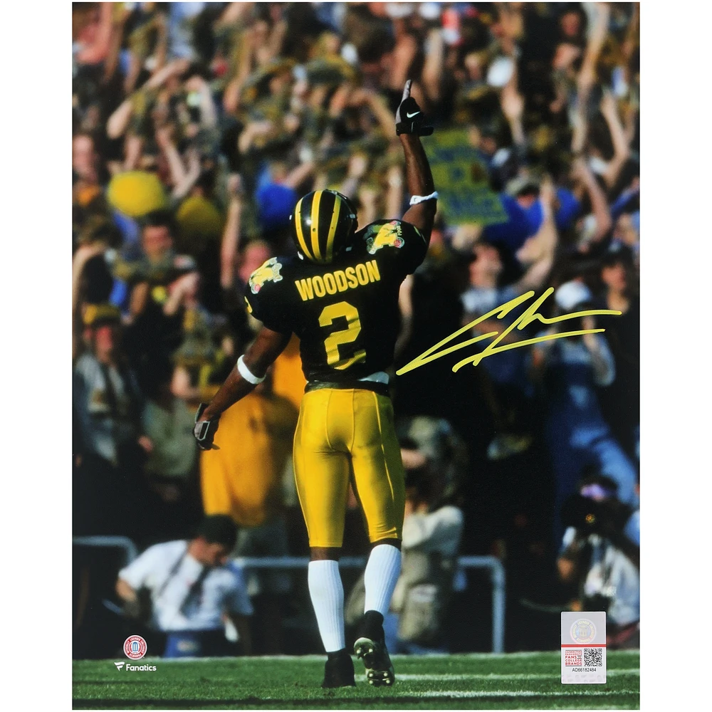 Charles Woodson Michigan Wolverines Autographed 8" x 10" Pointing Up Photograph - Signed in Yellow Ink
