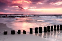 Dennis Aquino - Wooden Beach Old Structure Sunset