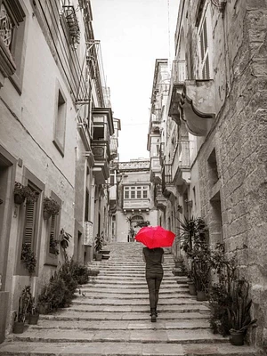 Assaf Frank - Tourist with umbrella steps through houses Birgu