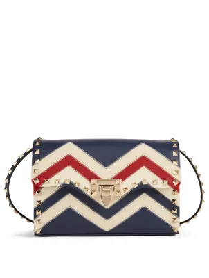 Medium Rockstud Leather Crossbody Bag In Chevron