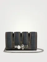The Slash Four-Ring Denim Clutch