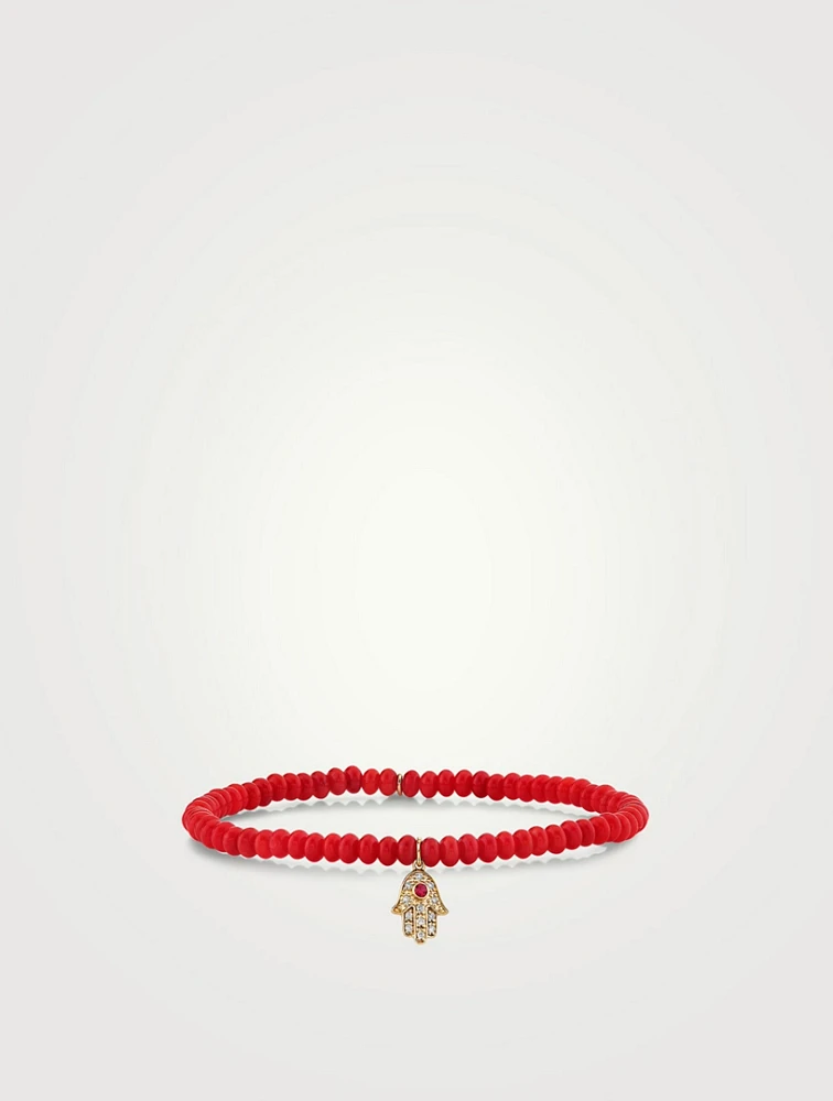 Coral Beaded Bracelet With Gold Ruby And Diamond Hamsa Charm