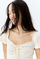 Lace-Trimmed Dress with Flared Skirt